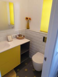 a bathroom with a toilet and a sink and mirror at Casa cerca de Cabárceno en Parque Natural de Peña Cabarga in Liérganes