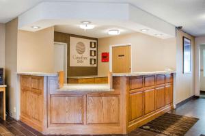 a bar with wooden cabinets in a room at Comfort Inn in Idaho Falls