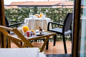 a table with food and drinks on a balcony at Il Principe Resort in Agerola +59 photos