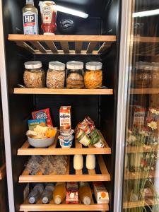 a refrigerator filled with lots of different food items at Henwick house accommodation, Continental breakfast included in Ludlow