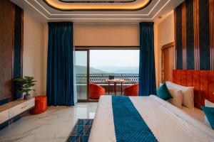 a hotel room with a bed and a large window at Ghatjai Mansion2 in Panchgani +50 photos