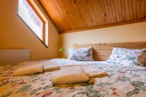 Ένα ή περισσότερα κρεβάτια σε δωμάτιο στο Penzion JAS