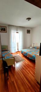 Postel nebo postele na pokoji v ubytování Casa Affitto Daone