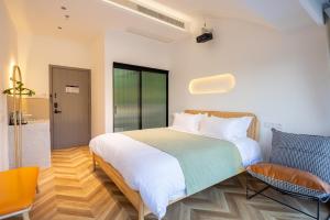 Suzhou Zhouzhuang Slowlife River View lnn客房内的一张或多张床位