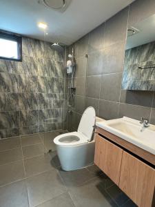 a bathroom with a toilet and a sink at 4Beds 4Baths New Renovated Entire House BTS Ekkamai in Bangkok +39 photos