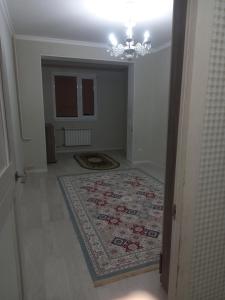 En eller flere senge i et værelse på Актау