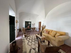 a living room with a couch and a table at Casa Pimenta in Vidigueira