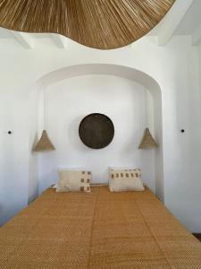 a bedroom with a large bed with a round ceiling at Casa Pimenta in Vidigueira +50 photos