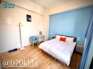 Postelja oz. postelje v sobi nastanitve Huatian B&B