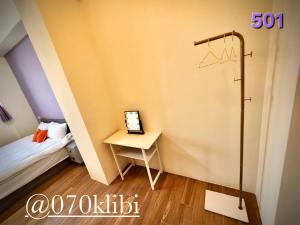 Postelja oz. postelje v sobi nastanitve Huatian B&B