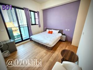 Postelja oz. postelje v sobi nastanitve Huatian B&B