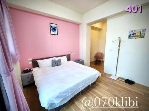 Postelja oz. postelje v sobi nastanitve Huatian B&B