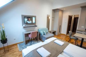 TV i/ili multimedijalni sistem u objektu Végvár Spa Apartman