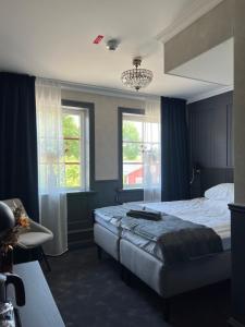 Postel nebo postele na pokoji v ubytování Central Hotellet Tierp