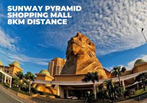a sign for the sunway pyramid shopping mall with a lion statue at Woco Boutique Hotel Kinrara in Puchong