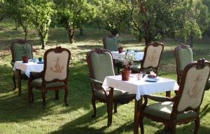 a group of tables and chairs with white tables at Les Vergers de Saint Paul in Saint Paul de Vence +69 photos