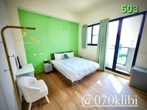 Postelja oz. postelje v sobi nastanitve Huatian B&B