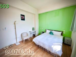 Postelja oz. postelje v sobi nastanitve Huatian B&B