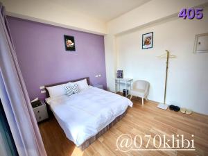 Postelja oz. postelje v sobi nastanitve Huatian B&B