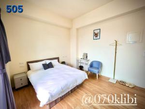 Postelja oz. postelje v sobi nastanitve Huatian B&B