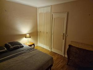 Un ou plusieurs lits dans un hébergement de l'établissement Appartement cosy climatisé