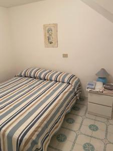 Rosa Marina Frontline Beach客房内的一张或多张床位