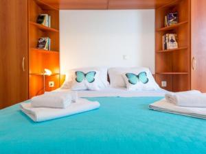 Posteľ alebo postele v izbe v ubytovaní Feel Good Apartment