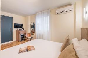 Postel nebo postele na pokoji v ubytování Granada Suites by Olala Homes