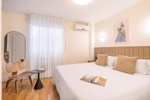 Postel nebo postele na pokoji v ubytování Granada Suites by Olala Homes