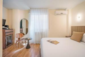 Postel nebo postele na pokoji v ubytování Granada Suites by Olala Homes