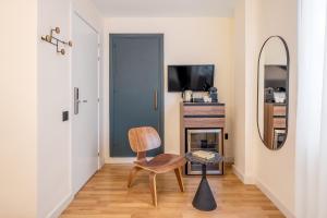 TV a/nebo společenská místnost v ubytování Granada Suites by Olala Homes