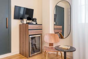 TV a/nebo společenská místnost v ubytování Granada Suites by Olala Homes