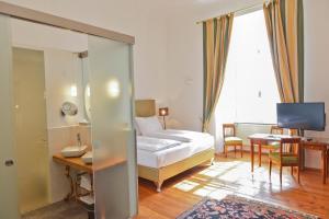 Katil atau katil-katil dalam bilik di Schlosshotel Mailberg