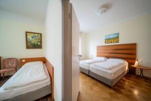Postel nebo postele na pokoji v ubytování Hotel La Perla