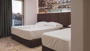 Postel nebo postele na pokoji v ubytování Hotel Ruko Boutique