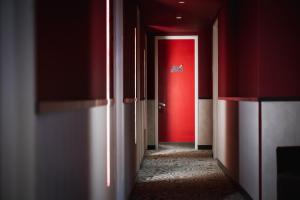 A bed or beds in a room at DuoMo Hotel