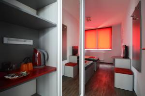 Łóżko lub łóżka w pokoju w obiekcie Pension Escrime