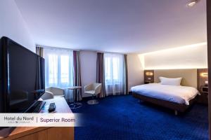 Postel nebo postele na pokoji v ubytování Hotel Du Nord