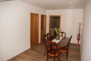 a dining room with a table and chairs at Casa do Barreiro in Baião