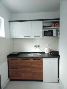 Kuchyňa alebo kuchynka v ubytovaní Apartmani Pause