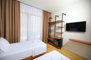Postel nebo postele na pokoji v ubytování Mezzanine Bay