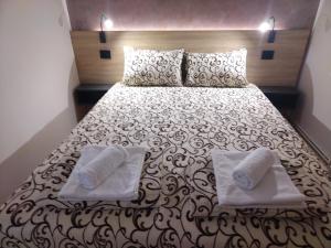 Posteľ alebo postele v izbe v ubytovaní Apartmani Pause