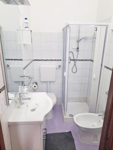 a bathroom with a sink and a toilet and a shower at Casa dei Trabocchi 2-3 in San Vito Chietino
