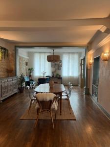 a dining room with a table and chairs at Relais Saint-Jean Levroux in Levroux