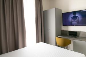 TV a/nebo společenská místnost v ubytování Hotel Cristallo