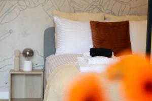 a bedroom with a bed with towels on it at Good Mood Francuska Retreat - FREE PARKING - Self check-in in Katowice +12 photos