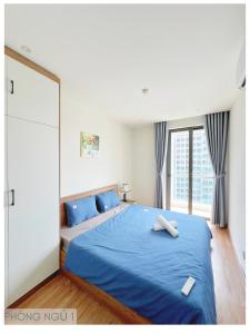 Ένα ή περισσότερα κρεβάτια σε δωμάτιο στο Green Bay Premium Ha Long homestay near Marina beach - Căn hộ chung cư cao cấp 2 phòng ngủ hướng vịnh Hạ Long