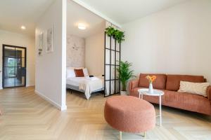 a living room with a couch and a bed at Good Mood Francuska Retreat - FREE PARKING - Self check-in in Katowice