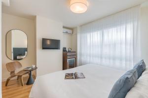 Postel nebo postele na pokoji v ubytování Granada Suites by Olala Homes