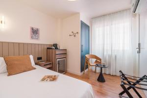 Postel nebo postele na pokoji v ubytování Granada Suites by Olala Homes